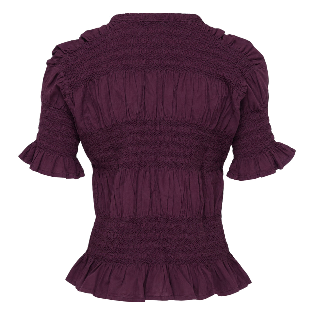 me Issey Miyake Shrink Stripe Short Sleeve Top in black, featuring horizontal smocked banding, puff sleeves with ruffle cuffs, and a flounced peplum hem, displayed on a flat lay against a white background