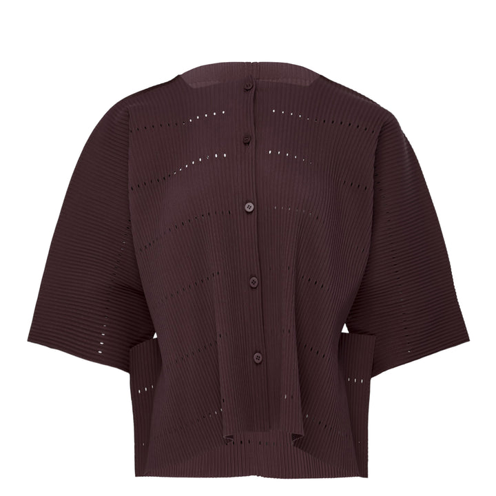 me Issey Miyake Tower Pleats Cardigan in cobalt blue, back view, featuring radiating openwork cutouts, tonal buttons, patch hip pockets, and cropped elbow-length sleeves