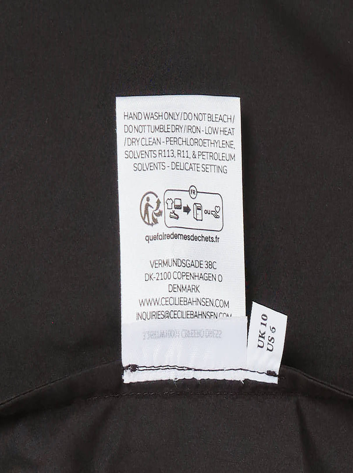 Cecilie Bahnsen Recycled Faille Midi Dress in deep espresso brown, sleeveless with a round neckline, relaxed cocoon silhouette, and curved hem, shown on a white background - view 4