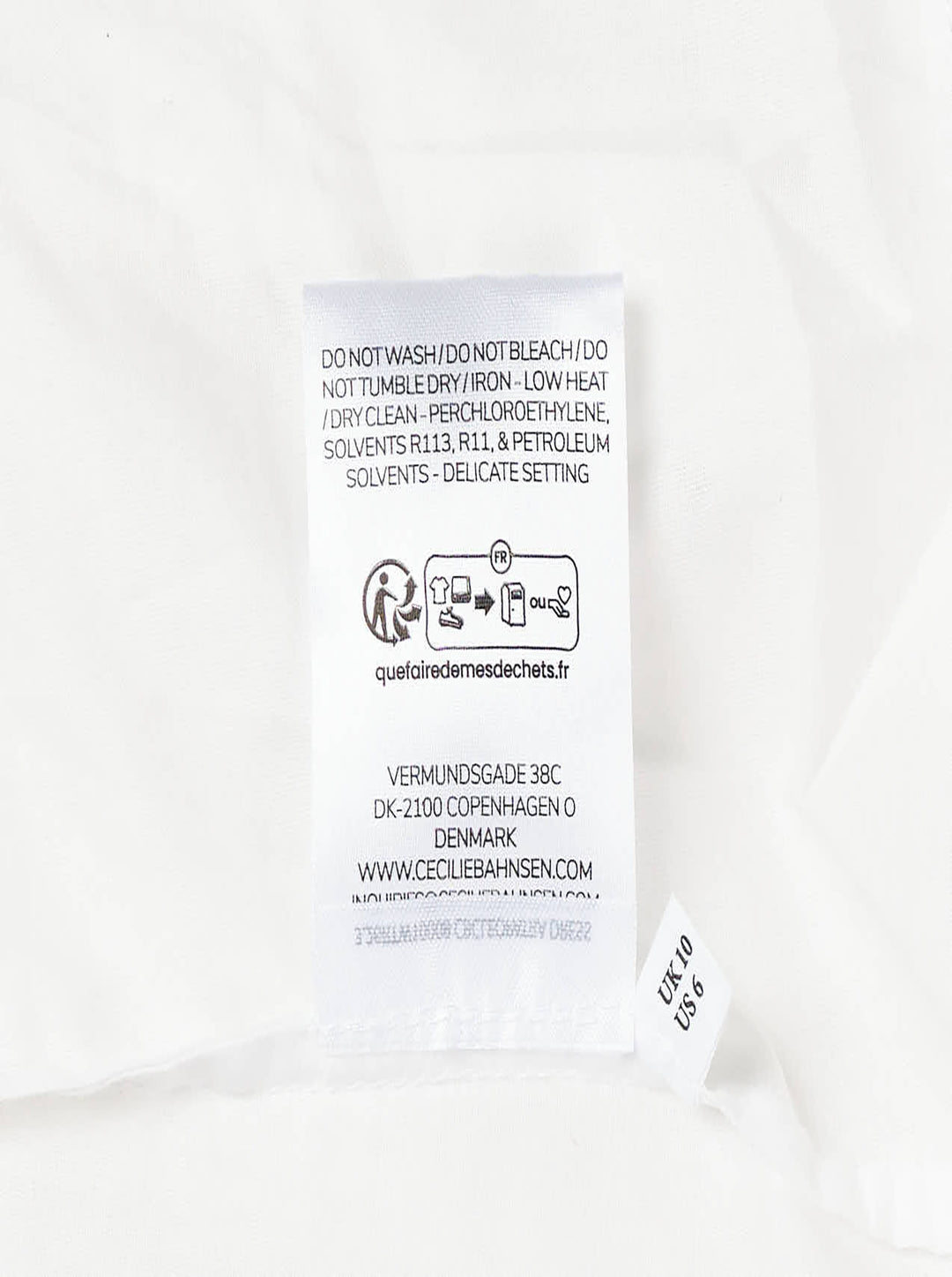 Cecilie Bahnsen Cleopatra Floratini midi dress in white textured jacquard with short puff sleeves, sculpted bodice, and full flared skirt, shown on a plain white background - view 4