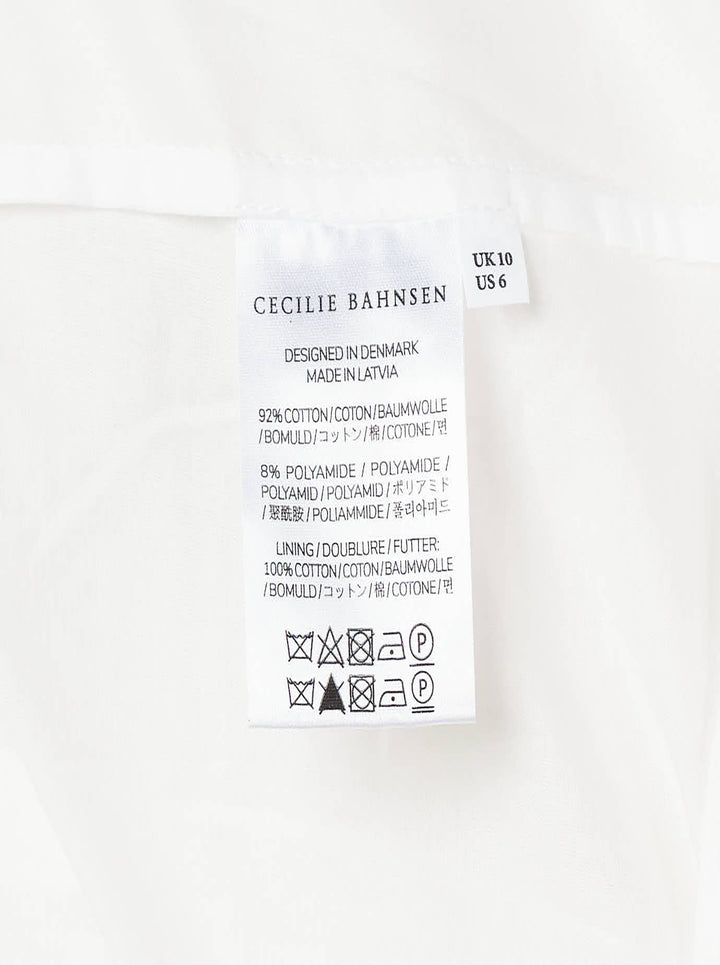 Cecilie Bahnsen Floratini Matelassé Midi Skirt in white, displayed flat, showing a voluminous A-line silhouette with an all-over raised jacquard texture and elasticated waistband - view 3