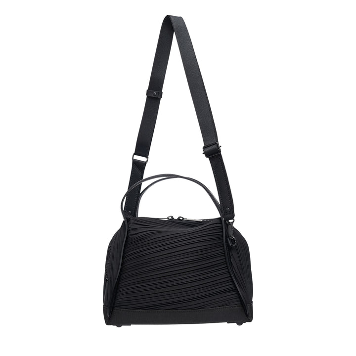 Pleats Please Issey Miyake Bias Pleats Crossbody Bag in black, showing diagonal pleated fabric body, dual top handles, and adjustable webbing shoulder strap on white background