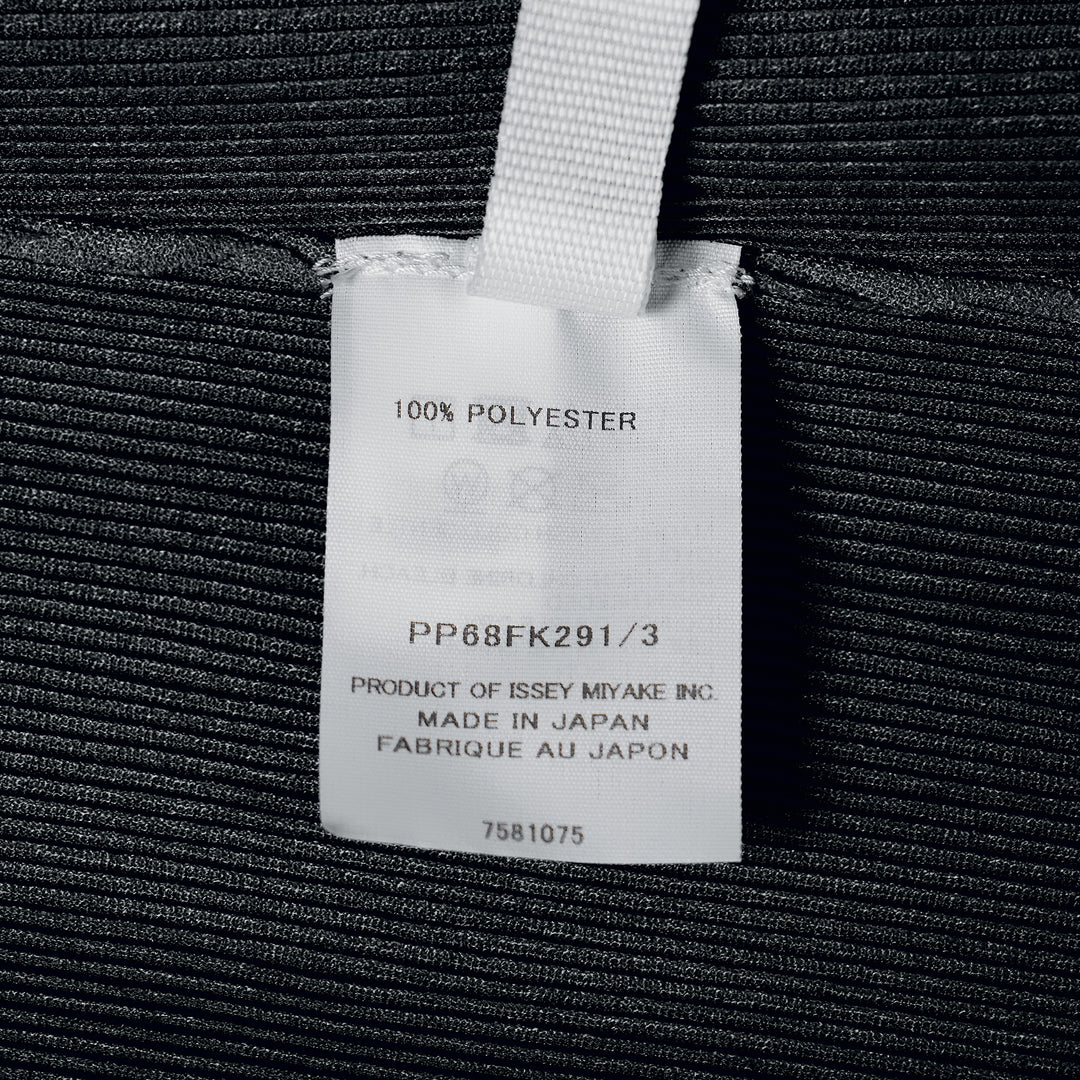 Pleats Please Issey Miyake black sleeveless pleated round neck tank top with fine vertical micro-pleating and fitted silhouette, front view on white background