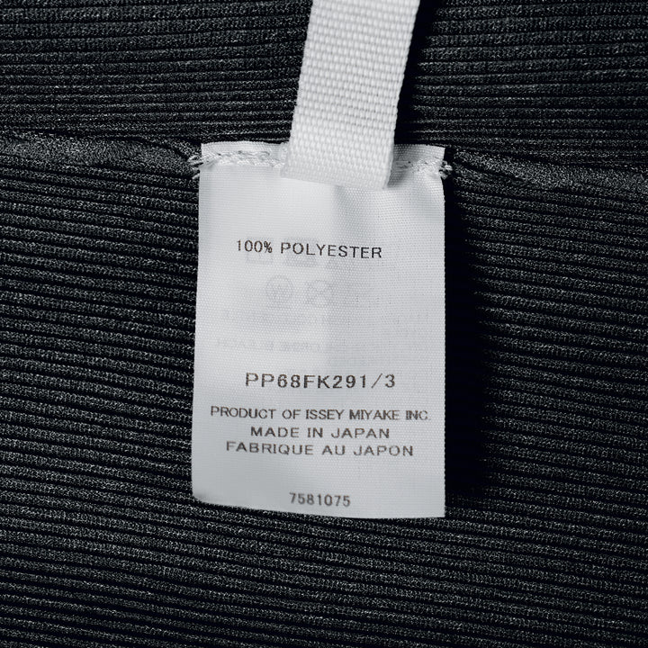 Pleats Please Issey Miyake black sleeveless pleated round neck tank top with fine vertical micro-pleating and fitted silhouette, front view on white background