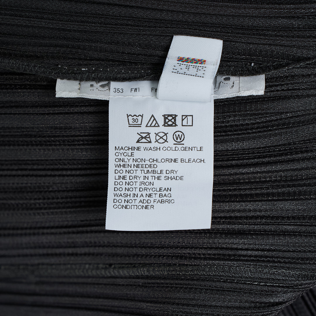 Pleats Please Issey Miyake Monthly Colors August black pleated blouson with full-length zip closure and spread collar, shown from the front
