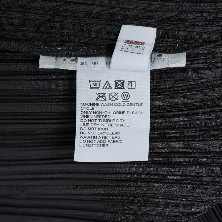 Pleats Please Issey Miyake Monthly Colors August black pleated blouson with full-length zip closure and spread collar, shown from the front