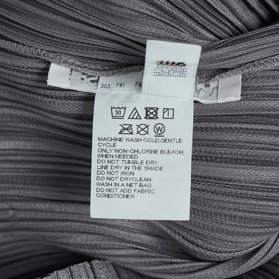 Pleats Please Issey Miyake Monthly Colors August black pleated blouson with full-length zip closure and spread collar, shown from the front