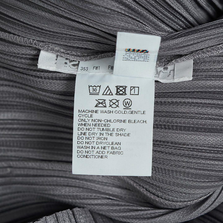 Pleats Please Issey Miyake Monthly Colors August black pleated blouson with full-length zip closure and spread collar, shown from the front