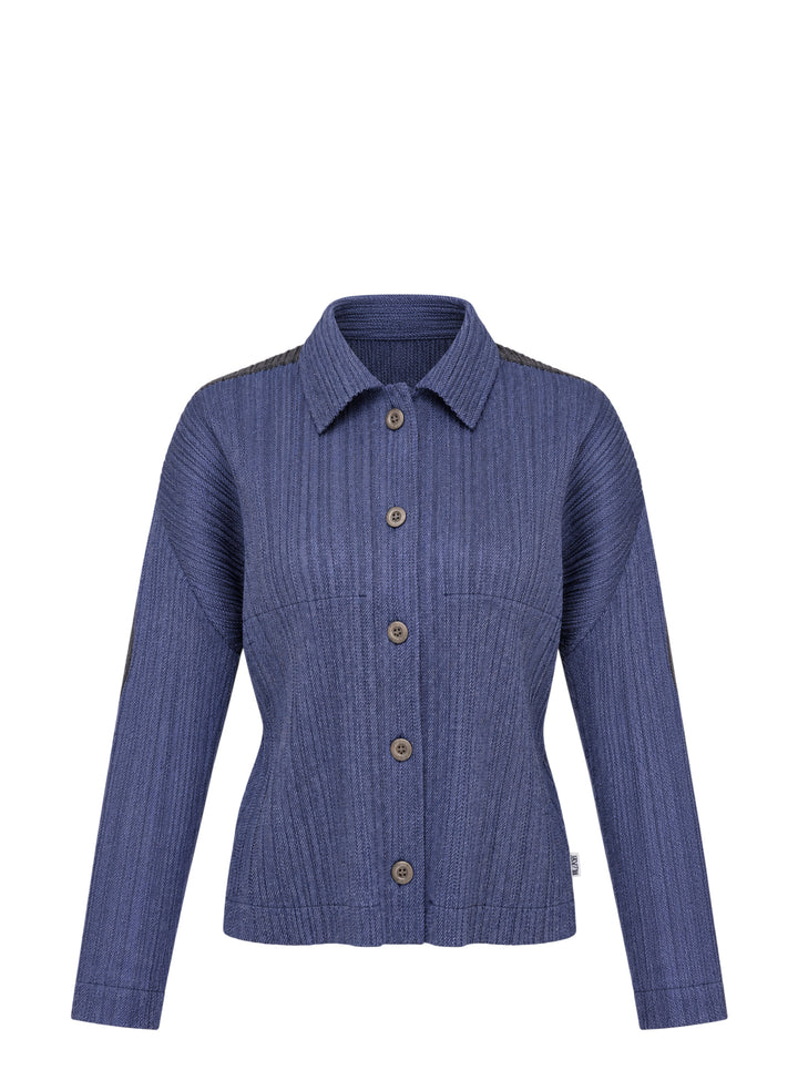 Pleats Please Issey Miyake Cotton Denim blouson in indigo blue with pleated texture, pointed collar, button front and darker shoulder panels