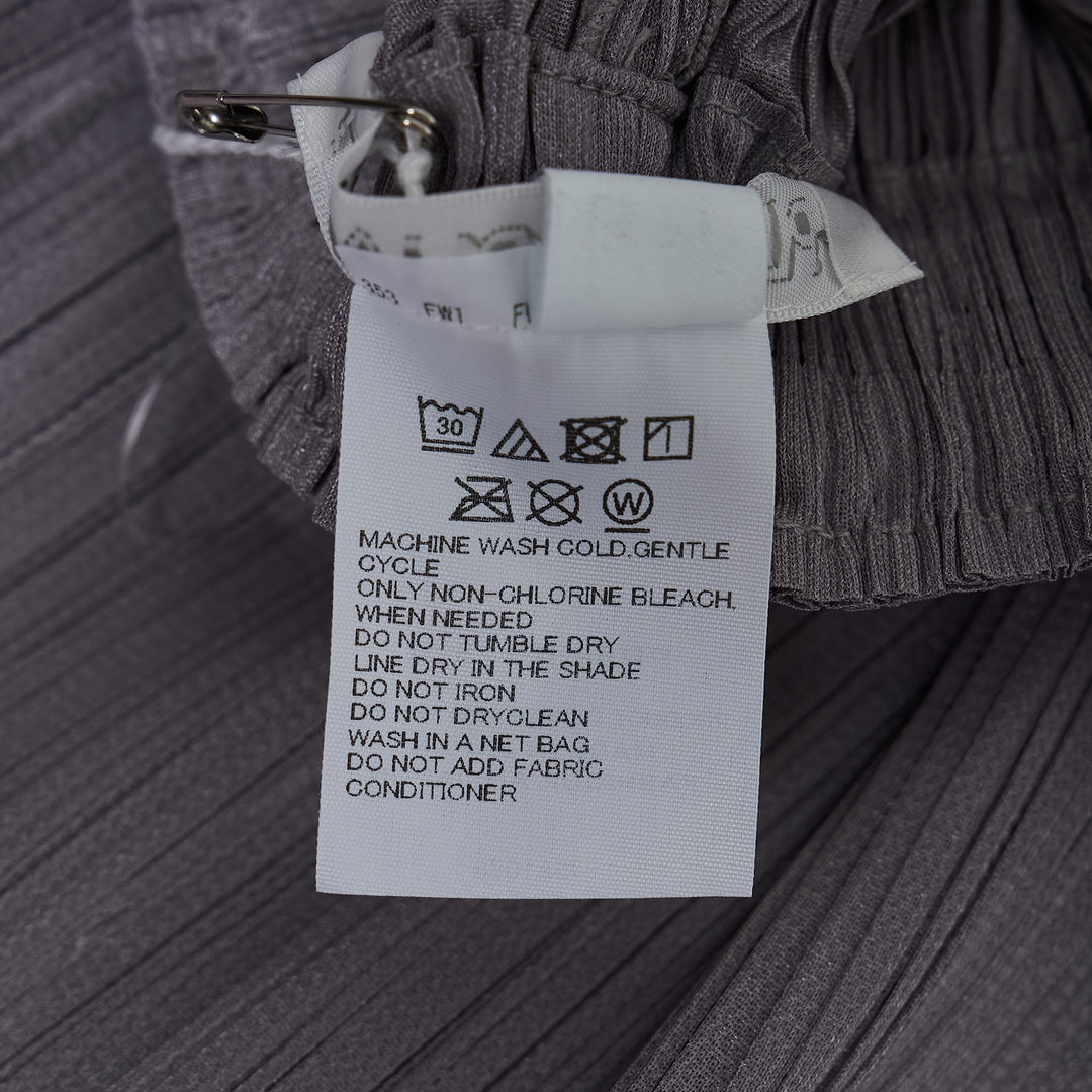 Pleats Please Issey Miyake Monthly Colors August wide-leg micro-pleated trousers in warm cream with elasticated waist