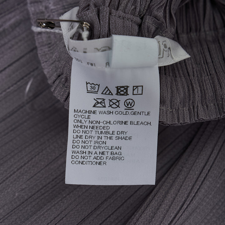 Pleats Please Issey Miyake Monthly Colors August wide-leg micro-pleated trousers in warm cream with elasticated waist