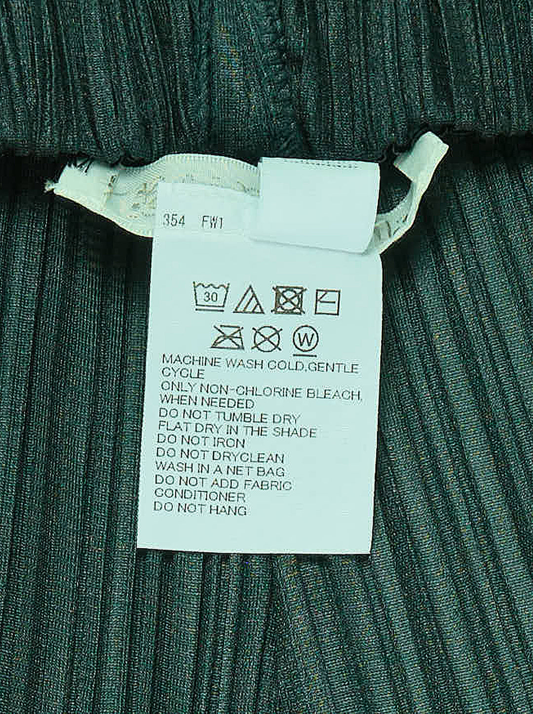Pleats Please Issey Miyake Monthly Colors October pleated flared pants in deep green with sculpted side panels and elasticated waist - view 3