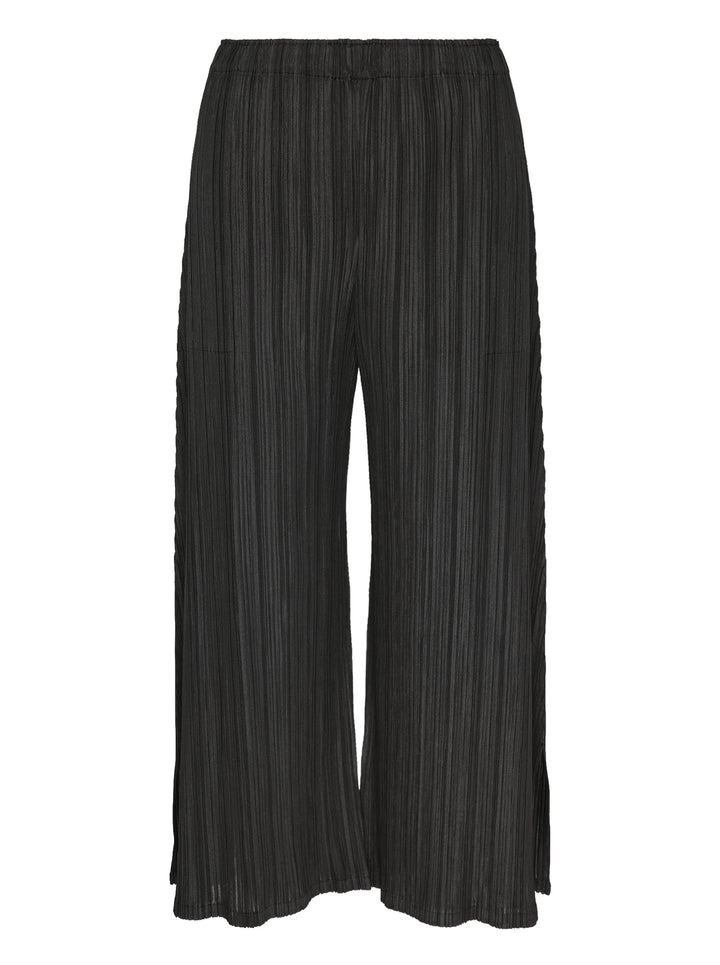 Pleats Please Issey Miyake Mellow Pleats Pants in black — wide-leg cropped silhouette with vertical micro-pleating, elasticated waistband, and side-slit hem, shown flat on white background