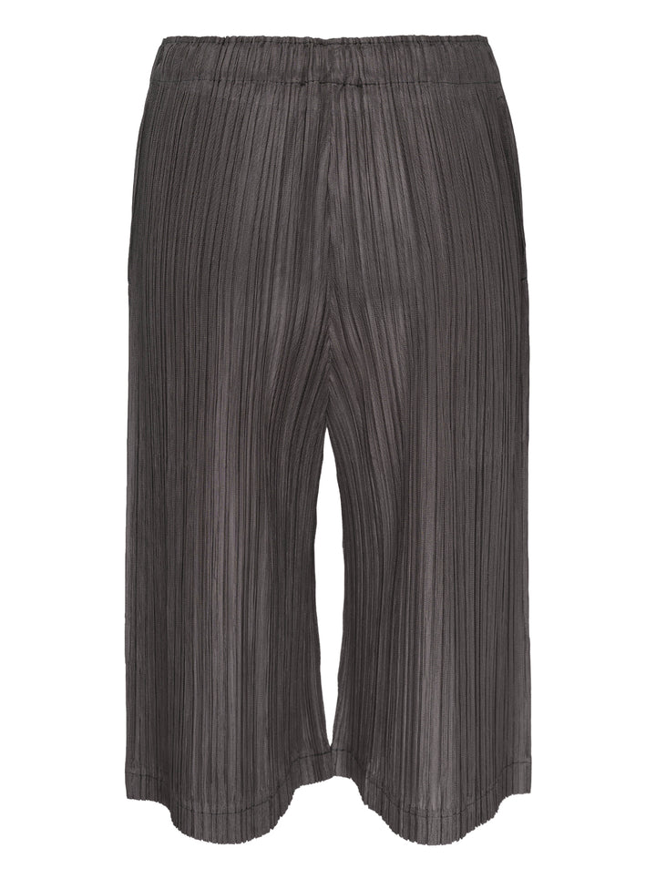 Pleats Please Issey Miyake Thicker Bottoms 2 wide-leg pleated culottes in charcoal with elasticated waistband and accordion micro-pleat construction - view 2