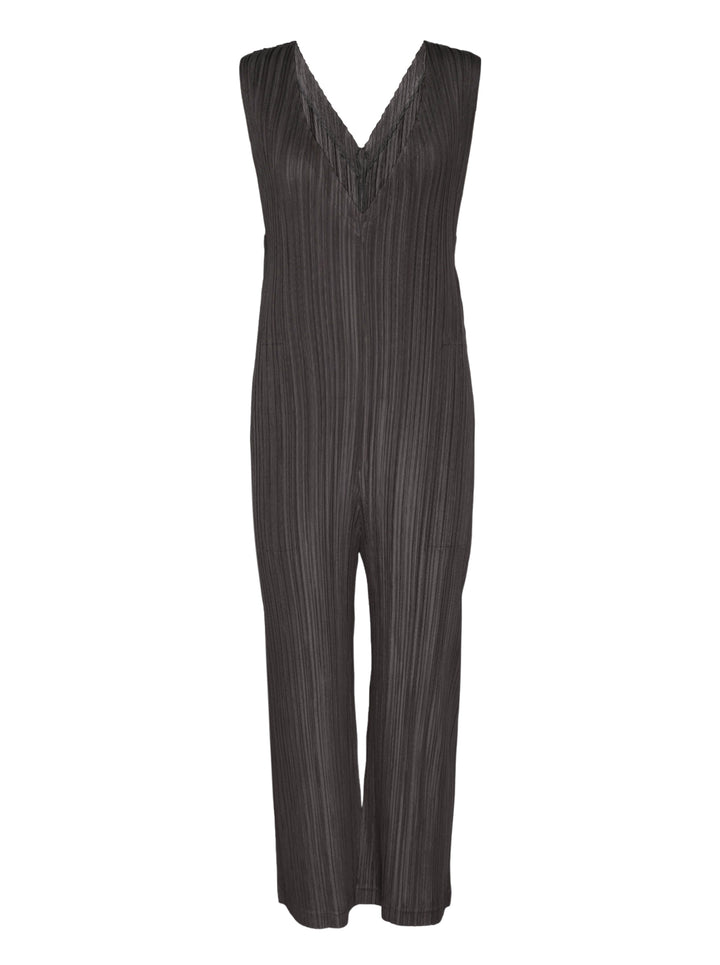 Pleats Please Issey Miyake Thicker Bottoms 2 Jumpsuit in charcoal, featuring a sleeveless V-neck with tonal lace trim, permanent-pleat fabric, and a relaxed wide-leg silhouette