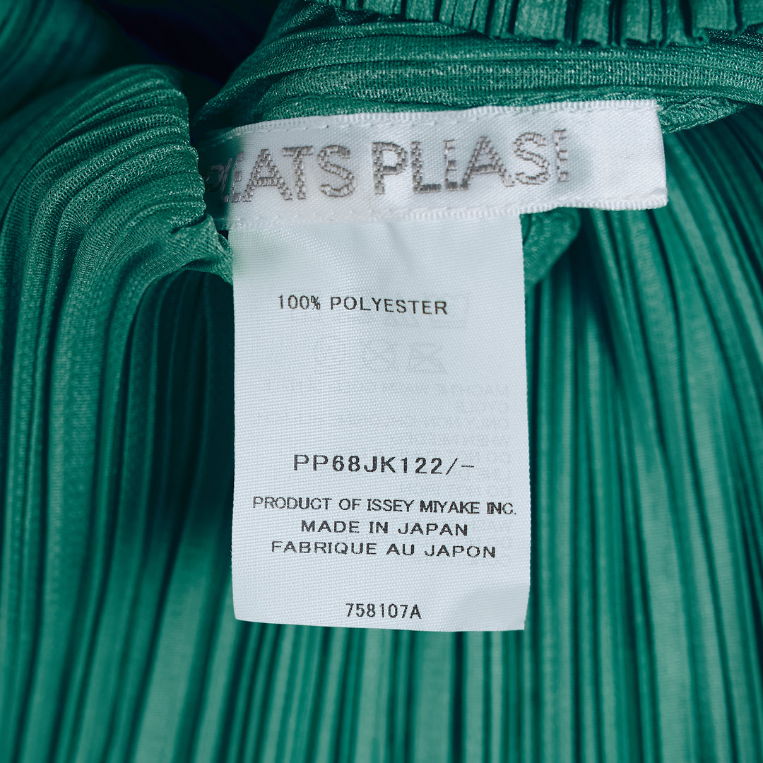 Pleats Please Issey Miyake Monthly Colors August short sleeve top in charcoal grey, featuring all-over permanent pleating, a V-neckline, and a fitted silhouette