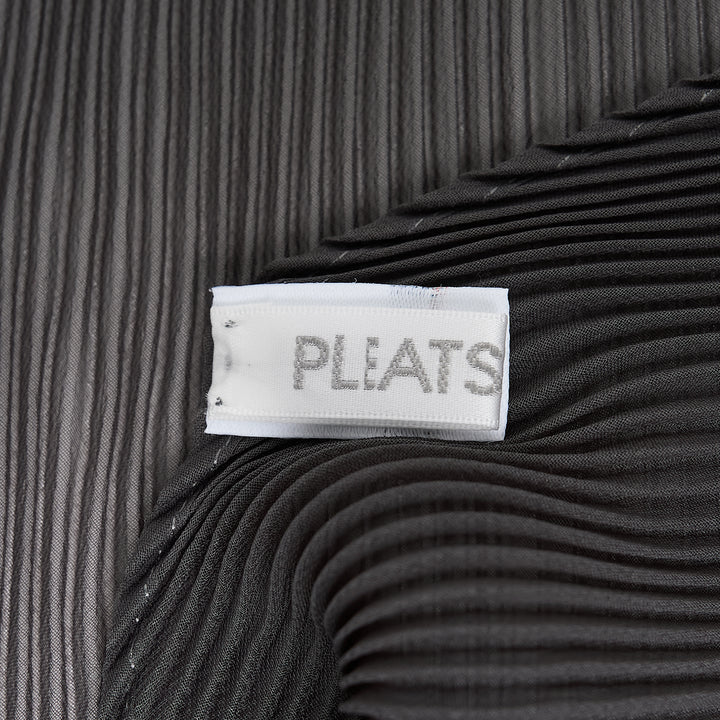 Pleats Please Issey Miyake Monthly Scarf August in charcoal grey, displayed in a folded diamond silhouette showcasing the signature micro-pleated texture