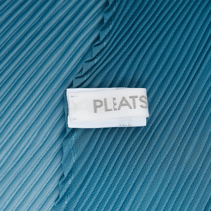 Pleats Please Issey Miyake Monthly Scarf August in charcoal grey, displayed in a folded diamond silhouette showcasing the signature micro-pleated texture