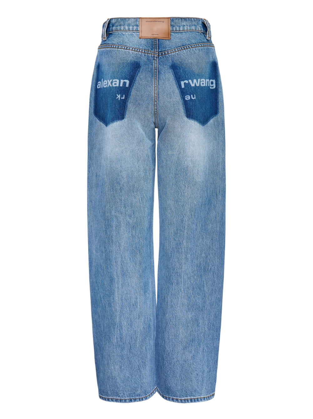 Alexander Wang Float Jeans in washed mid-blue denim with a high rise and curved twisted-seam leg, shown from the front - view 2