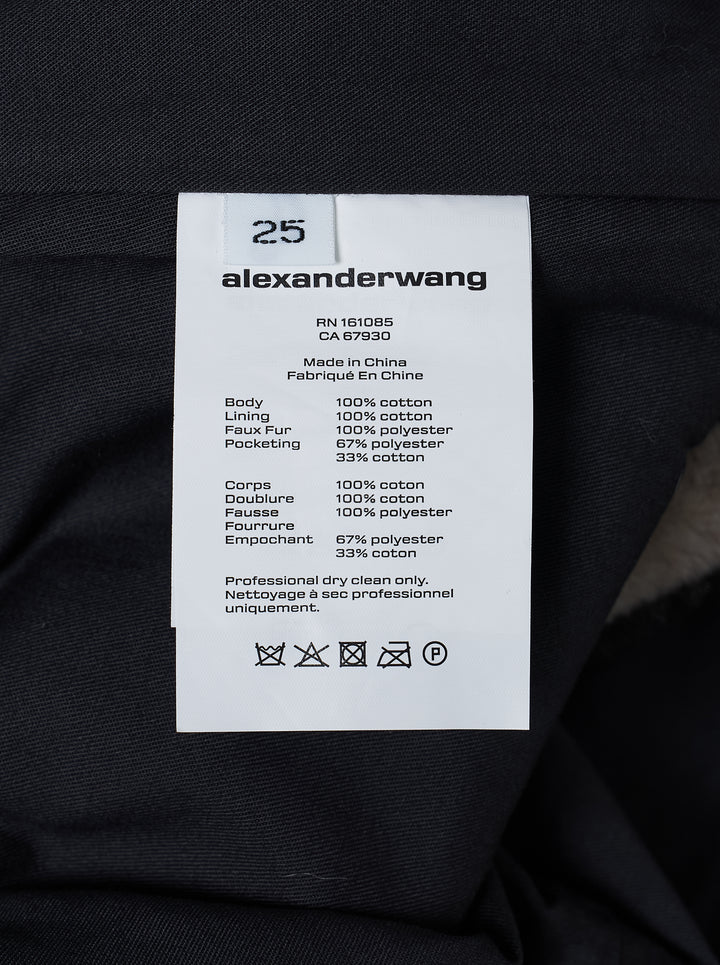 Alexander Wang washed blue denim mini skirt with faux mink trim along the hem and side vents, shown from the front - view 3
