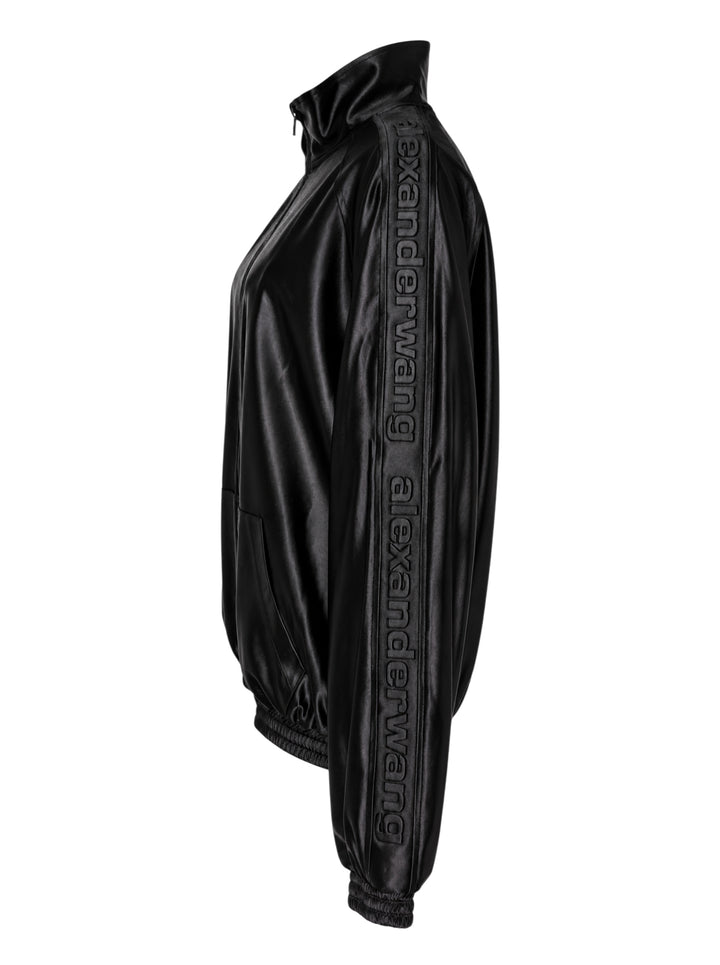 Alexander Wang black satin oversized track jacket with embossed logo tape on the sleeves, funnel neck and smocked hem - view 3