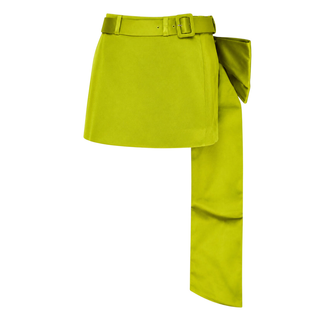 Self-Portrait lime green belted mini skirt over straight-leg trousers hybrid garment, laid flat on a white background, featuring a self-covered buckle belt and smooth satin-finish fabric