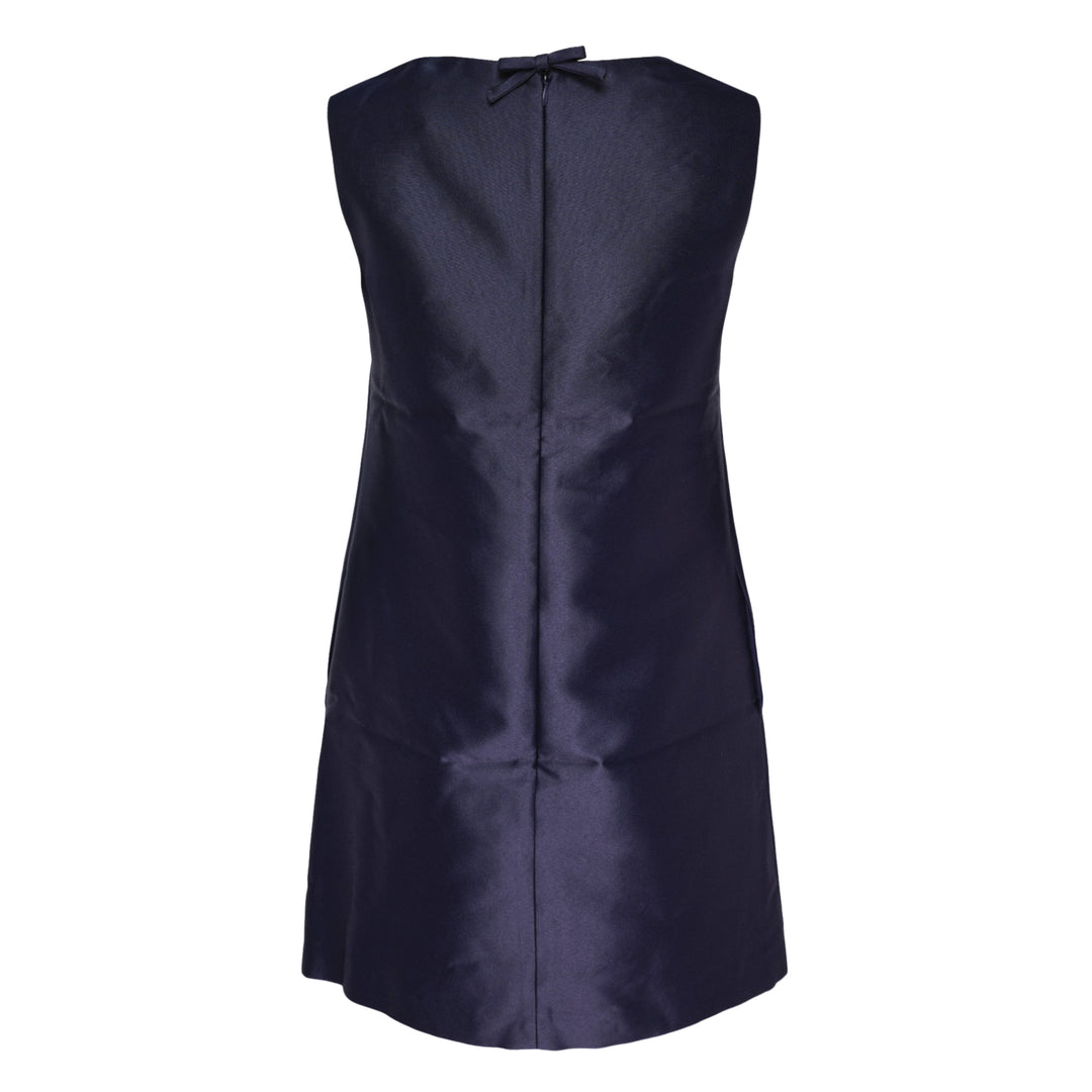 Self-Portrait navy taffeta mini dress with white guipure lace neckline yoke and floral lace appliqué on the front bodice, sleeveless A-line silhouette