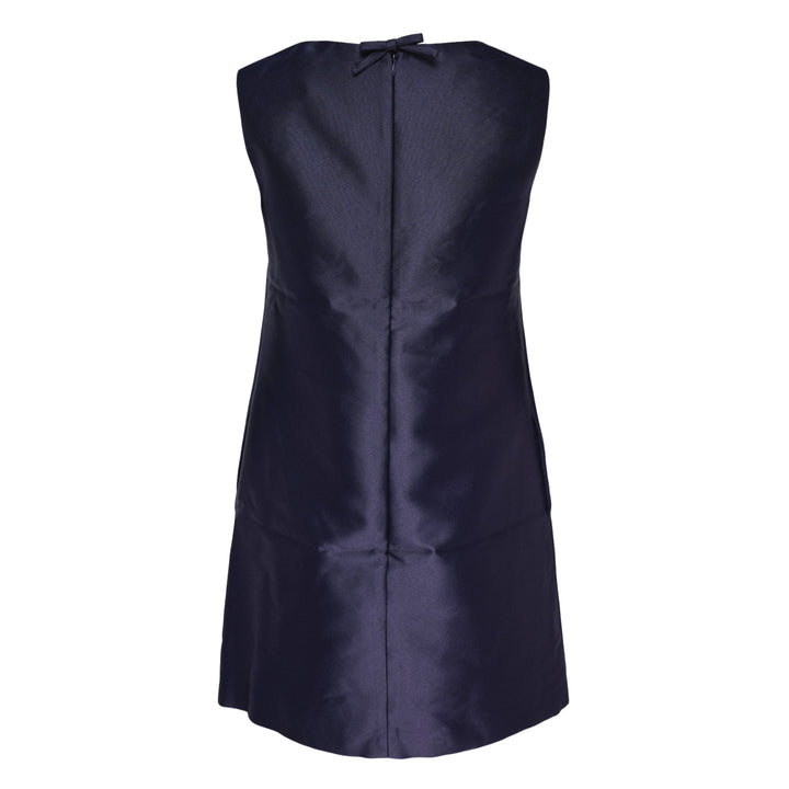 Self-Portrait navy taffeta mini dress with white guipure lace neckline yoke and floral lace appliqué on the front bodice, sleeveless A-line silhouette