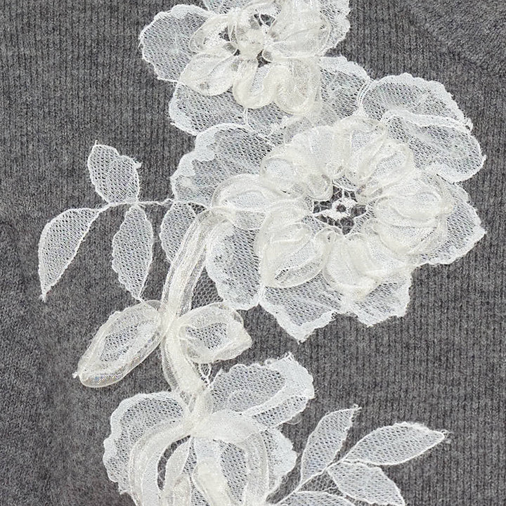 Self-Portrait grey knit cardigan with white 3D lace floral appliqués, scalloped neckline trim, and button-through front placket, laid flat on a white background