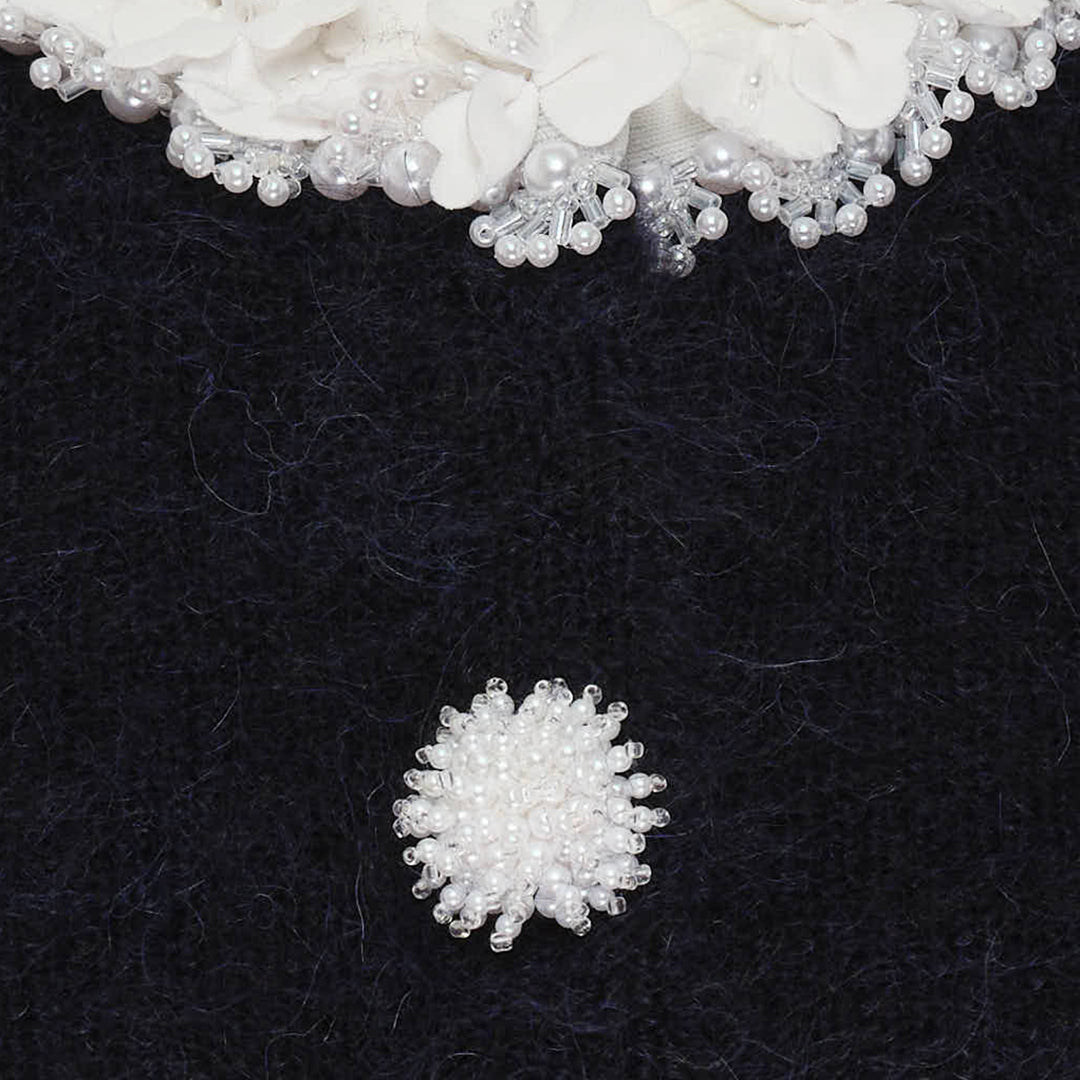 Self-Portrait navy brushed knit cardigan with daisy pearl button fastening and crystal ruffle-trimmed round neckline, displayed flat on a white background