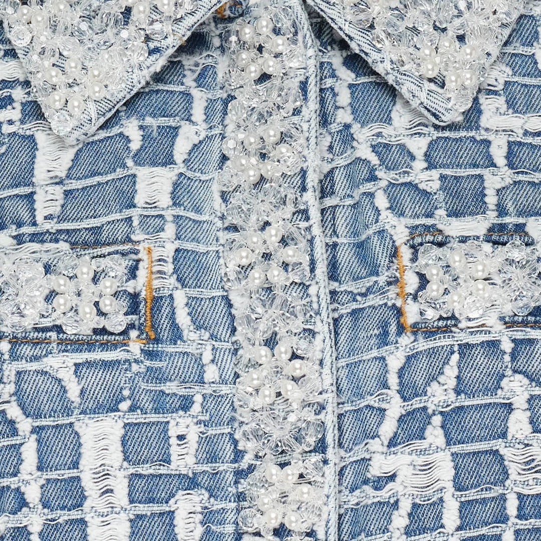 Self-Portrait blue textured tweed-effect denim mini dress with spread collar, lace trim detail, gold lion-head buttons, chest and patch pockets, and short sleeves