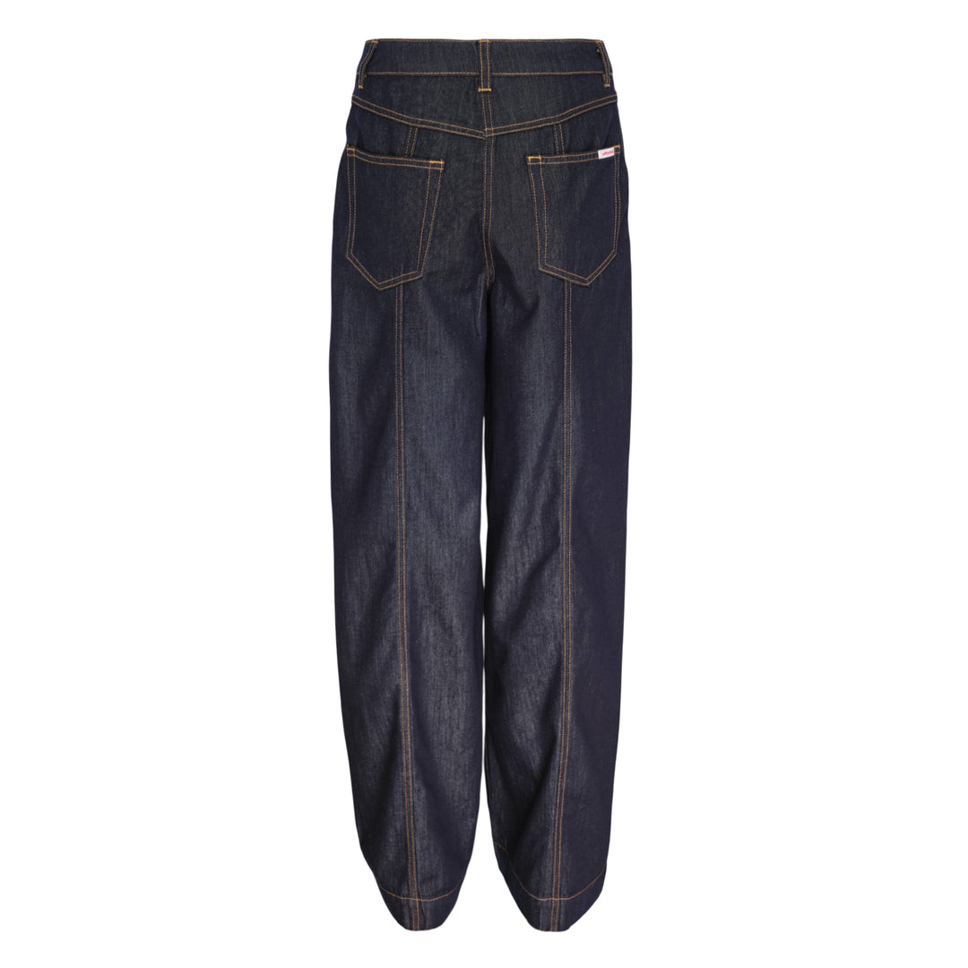 Self-Portrait Indigo Wide Leg Jeans in dark indigo denim with contrast amber topstitching, patch pockets, turned cuffs, and a tan leather belt with gold-tone buckle, laid flat on a white background