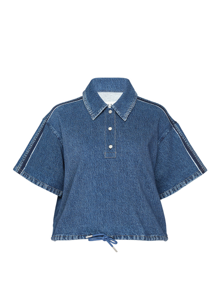 rag & bone Miramar Side Fray Polo Shirt in medium-wash denim with snap-button placket, contrast piping along the shoulder seams, raw fray detailing, and a drawstring cropped hem