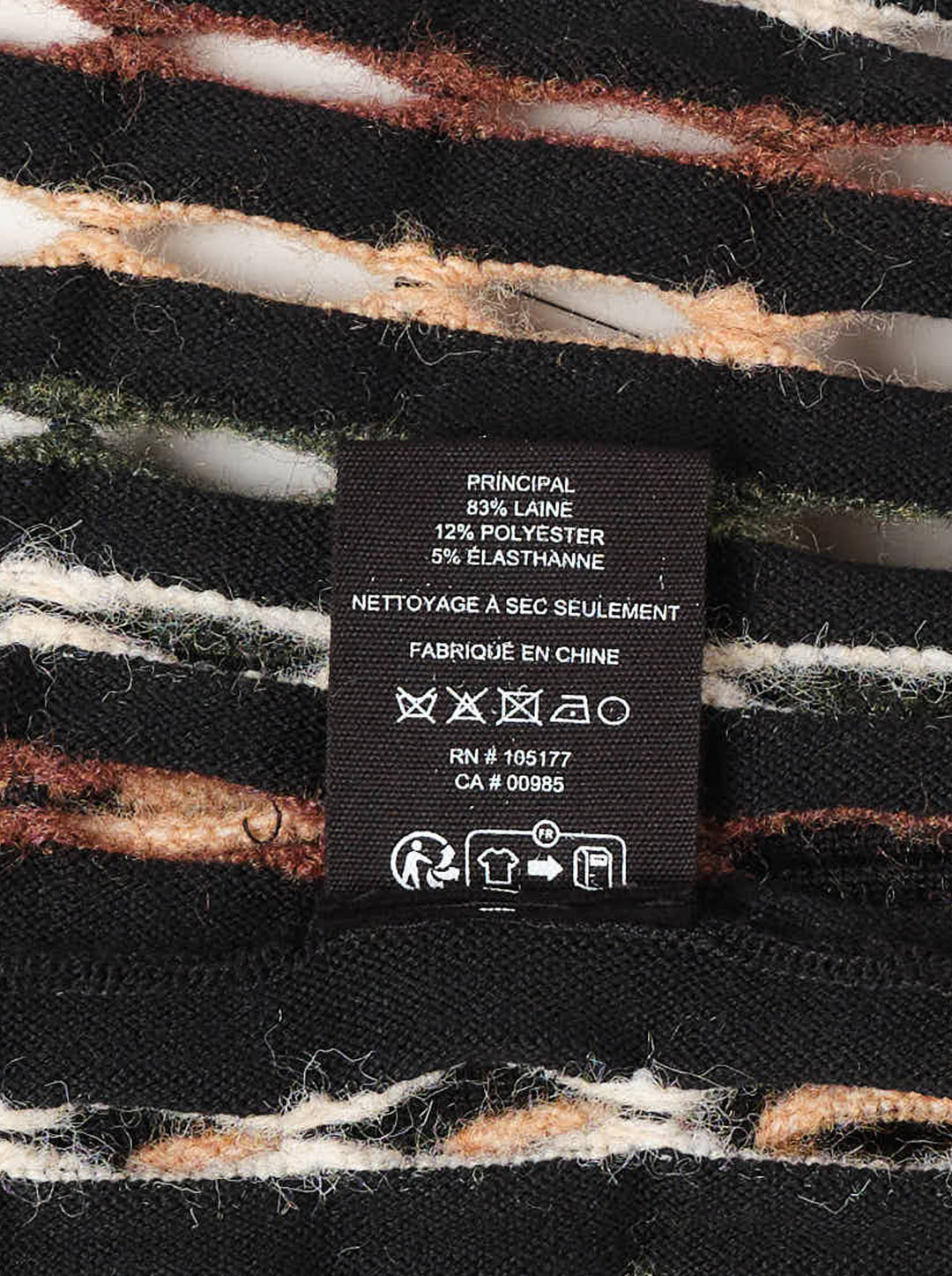 Ulla Johnson Zora Knit Cardigan with allover multicolour oval-stitch jacquard pattern in green, rust, cream, and blush on black, featuring a front zip closure, fringe hem, and long sleeves - view 4