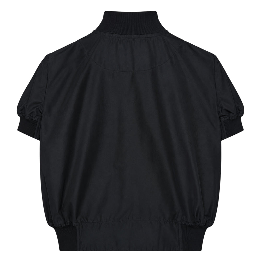 Melitta Baumeister Short Sleeve Bomber Shirt in black, featuring snap-button front closure, ribbed collar and cuffs, voluminous gathered sleeves, and a chest patch pocket