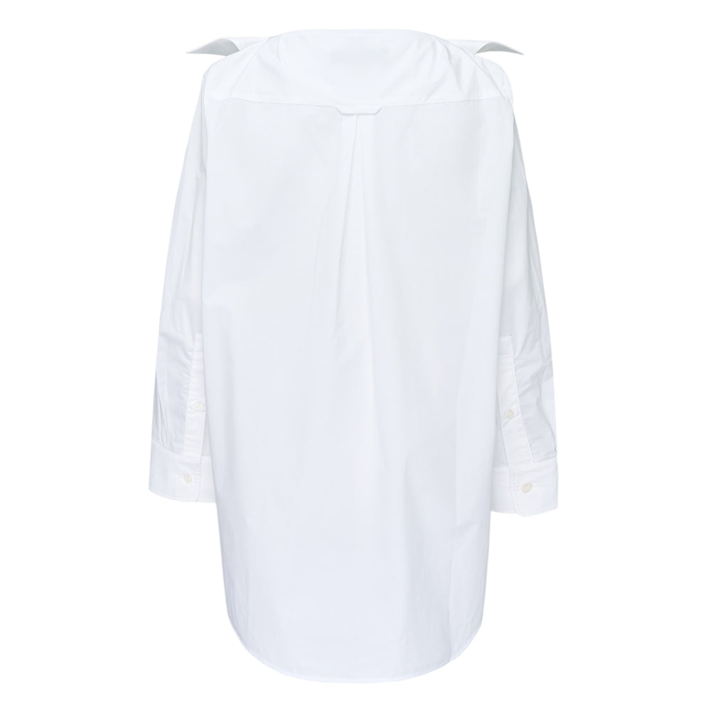 Melitta Baumeister Pointy Collar Shirt in white, back view, showing exaggerated sculptural pointed collar, centre-back box pleat, long sleeves with barrel cuffs, and curved high-low hem