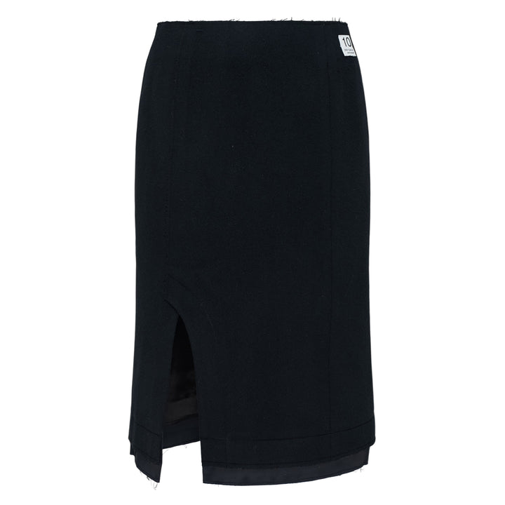 RE;CODE Slit H-Line Skirt in black, featuring a slim pencil silhouette, front slit with layered underlap, raw-fringed waistband, and woven brand label