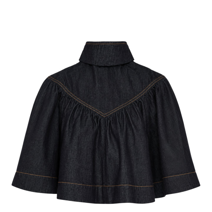 Zimmermann Denim Cape Top in dark indigo, back view, showing V-shaped gathered yoke, amber contrast topstitching, structured collar, and full sweeping hemline