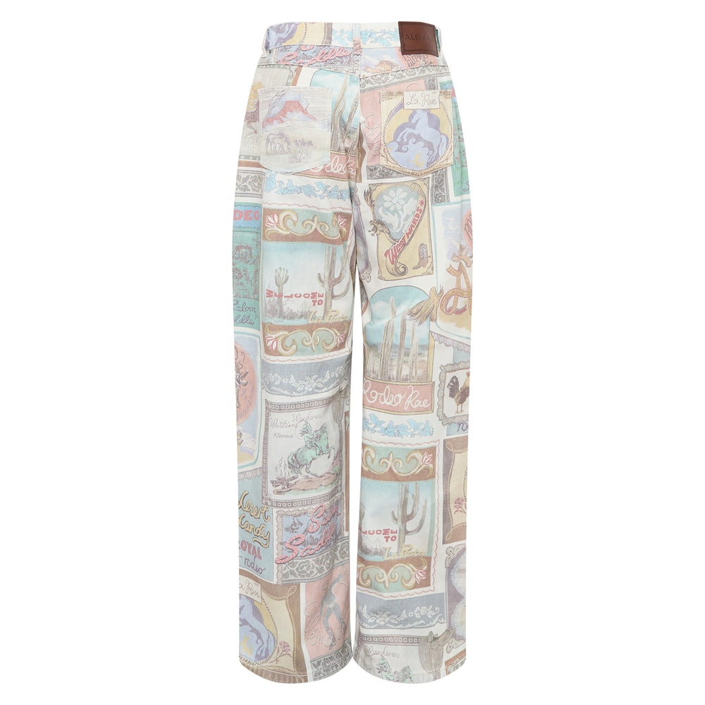 Alemais Andie Mid Rise Jeans in a wide-leg silhouette featuring an all-over pastel western postage stamp print with rodeo motifs, horses, and desert scenes - view 2