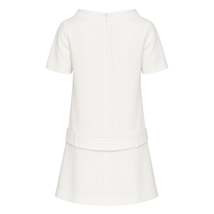 SHUSHU/TONG ivory textured short sleeve drop-waist dress with self-fabric bow detail at the waist and pleated skirt, front view