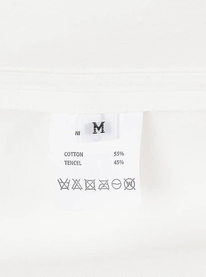 Musée RA white oversized shirt with pointed collar, button placket, chest pocket and open back tie detail, shown from the front - view 3