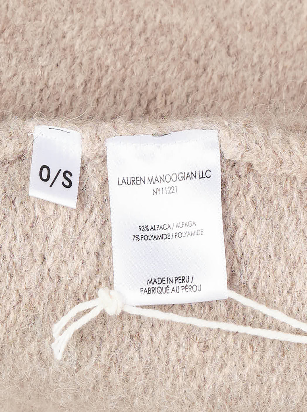 Lauren Manoogian Long Shawl Cardigan in heathered oatmeal, laid flat showing open-front silhouette, wide shawl collar, hip pockets, and woven brand label - view 3