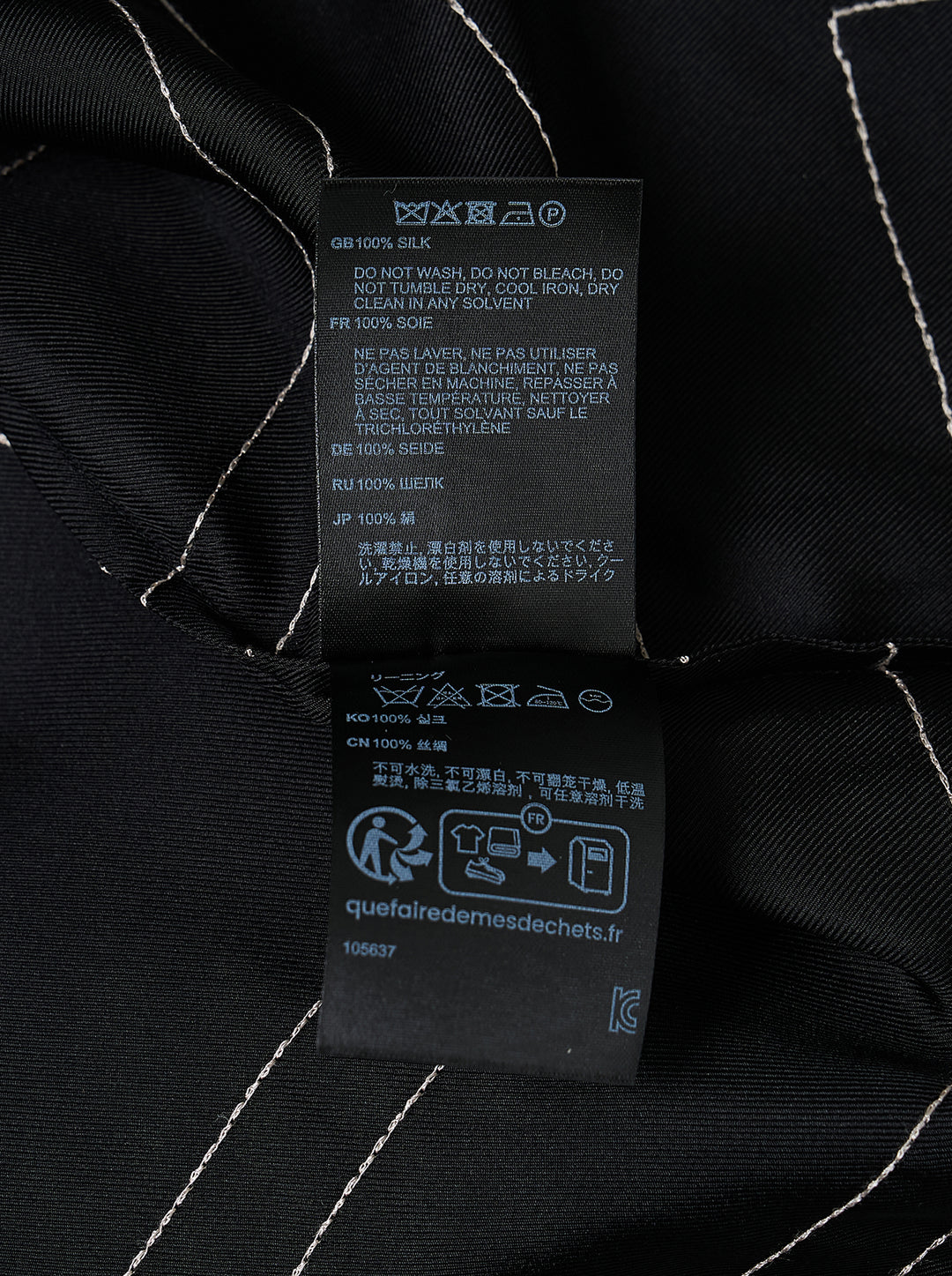 Totême Monogram Silk Pyjama Top in black, featuring all-over contrast-stitched monogram print, camp collar, partial button placket, and relaxed long-sleeve silhouette - view 3