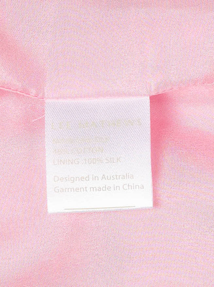 Lee Mathews Nina Silk Ruffle Dress in blush pink — sleeveless midi with panelled construction and a pleated ruffle hem, shown on a white background - view 3
