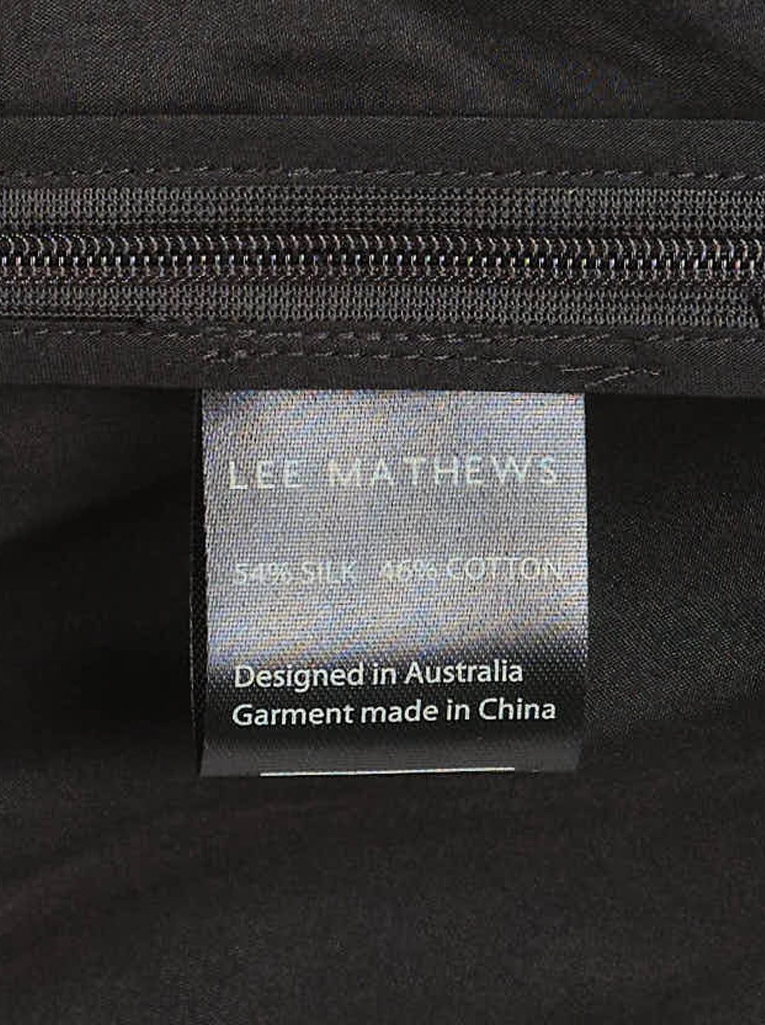 Lee Mathews Nina Silk Twist Top in black, featuring an asymmetric one-shoulder neckline and diagonal ruched twist draping across the body - view 3
