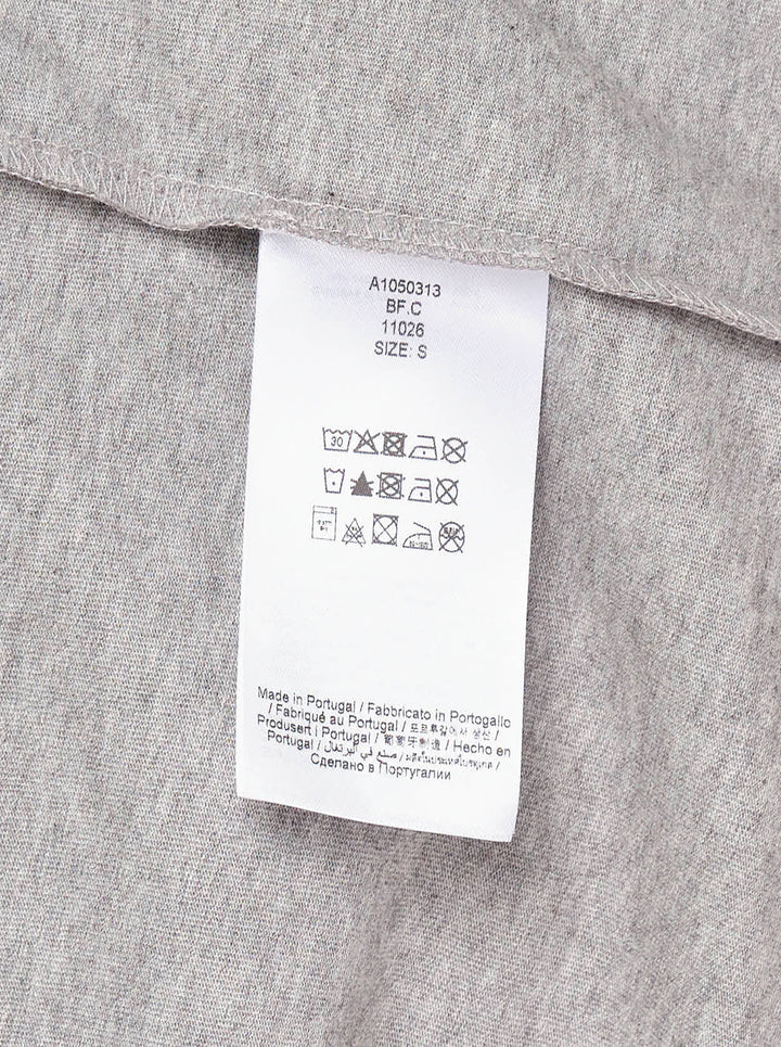 Ganni relaxed graphic cotton tee in heathered grey with orange flame-style Ganni logo, illustrated teddy bear holding a Ganni sign, pine forest motif, and 'Have a nice day! Please recycle' text on the front - view 3