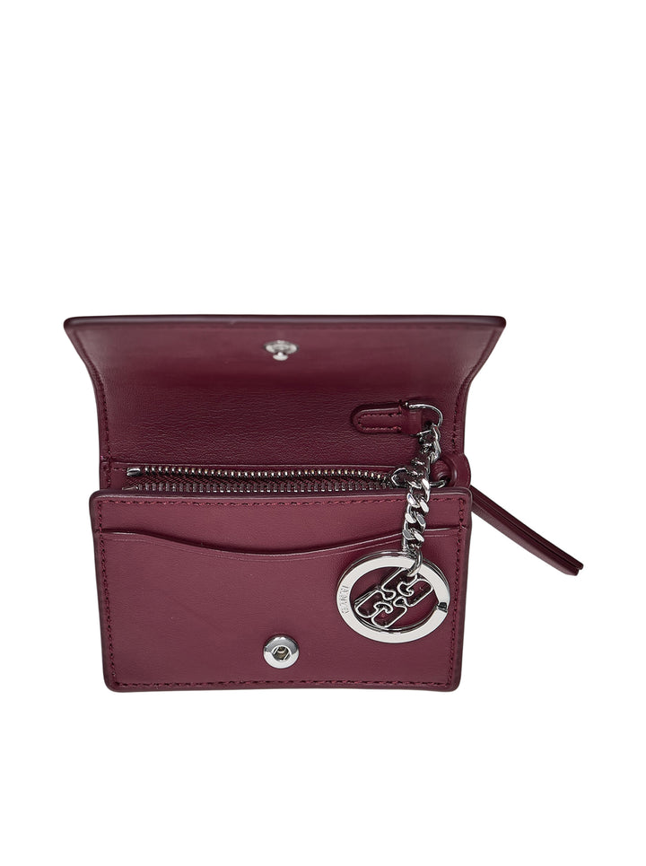 Ganni Bou Bear Print Card Holder in burgundy leather featuring an illustrated teddy bear and pine forest motif with a pink butterfly-knot clasp hardware detail - view 3