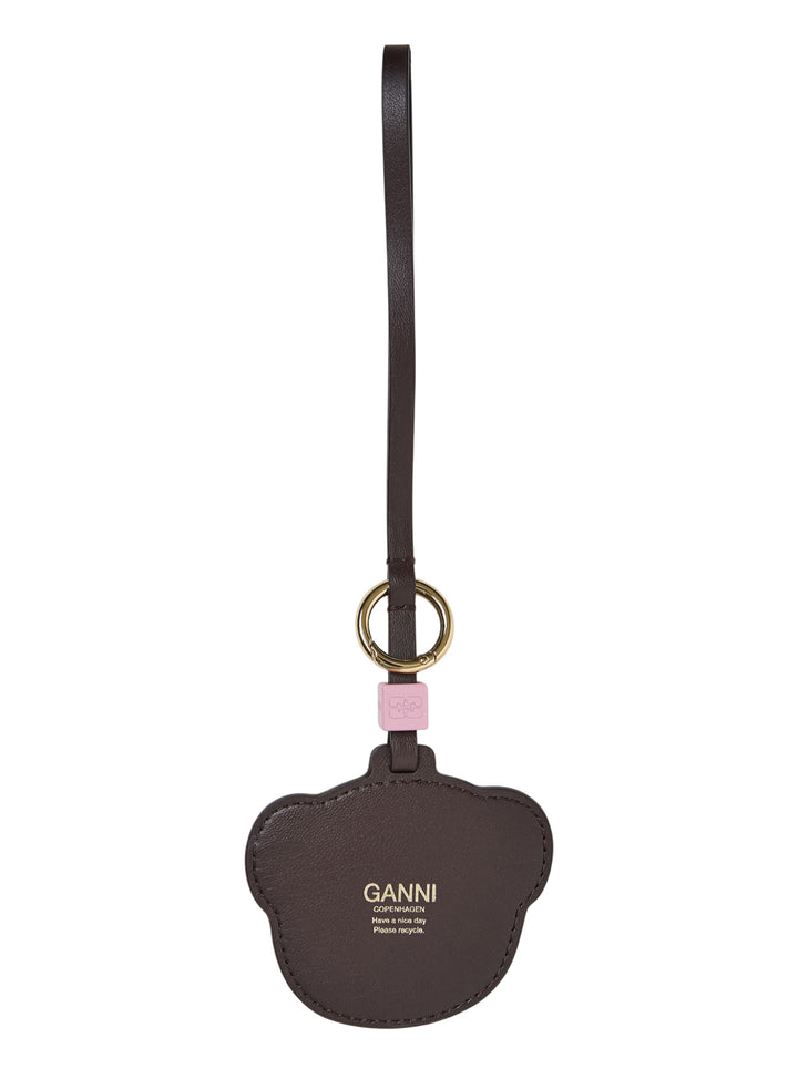 Ganni Teddy Bear Bag Charm featuring a chenille bear face, dark brown leather trim, gold-tone ring, and pink branded connector detail - view 2