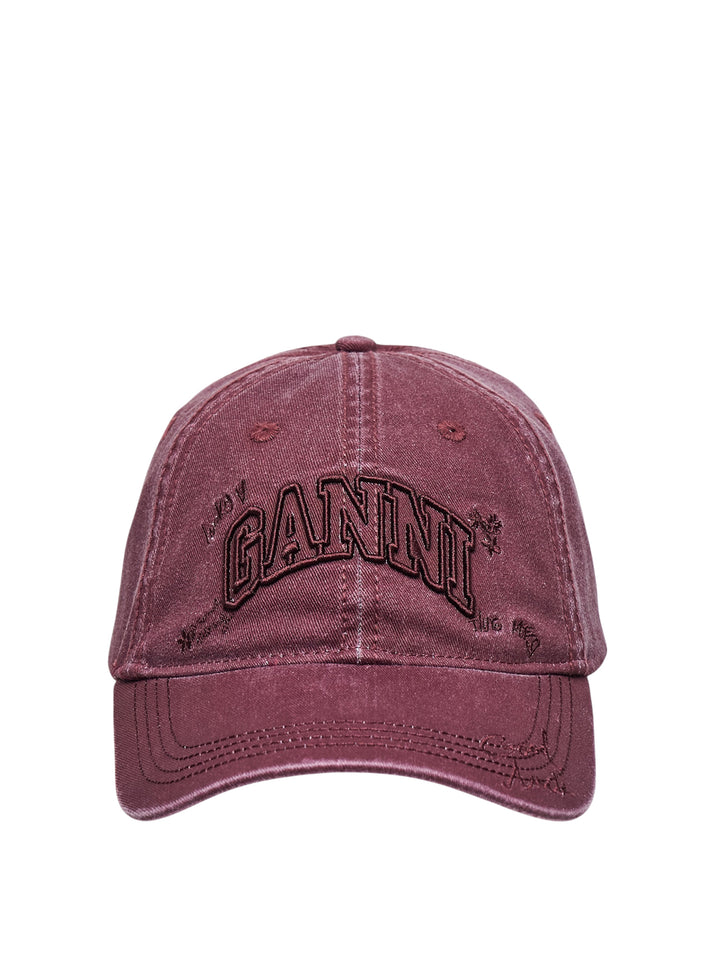 Ganni washed cotton baseball cap in burgundy with tonal arched logo embroidery and hand-drawn script and floral motif details on the front panel