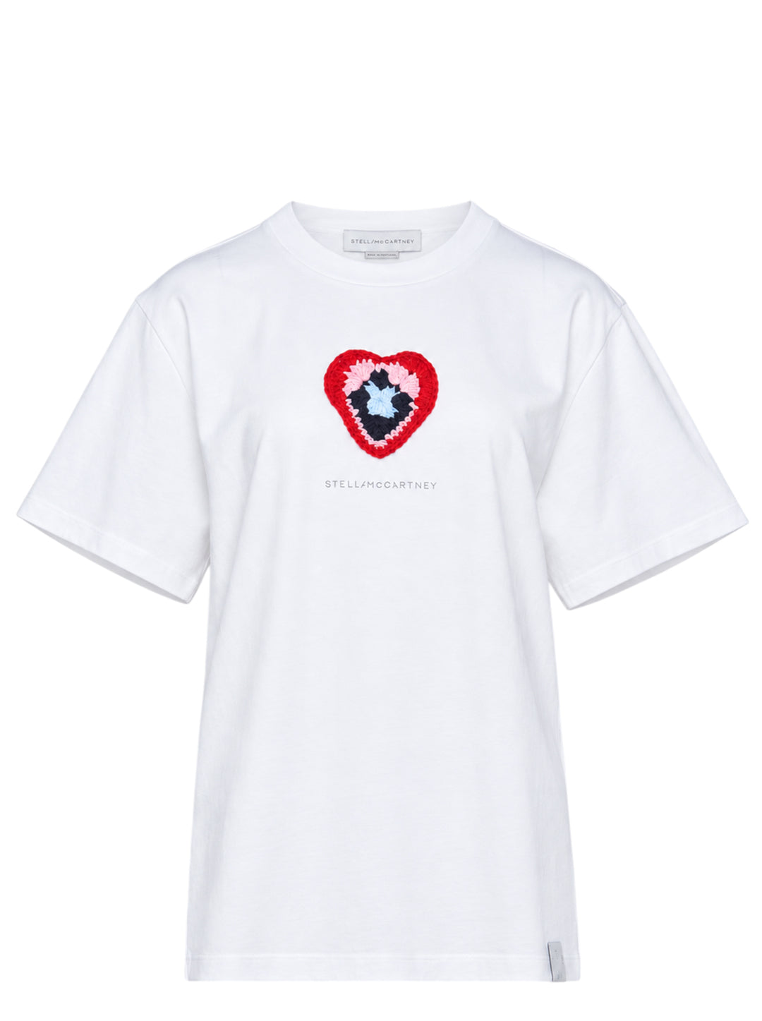 Stella McCartney white boyfriend T-shirt with a multicolour crochet heart appliqué at the chest and tonal logo print, shown flat on a white background